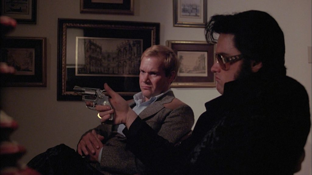 Elvis cocking the six-shooter: the epitome of cool