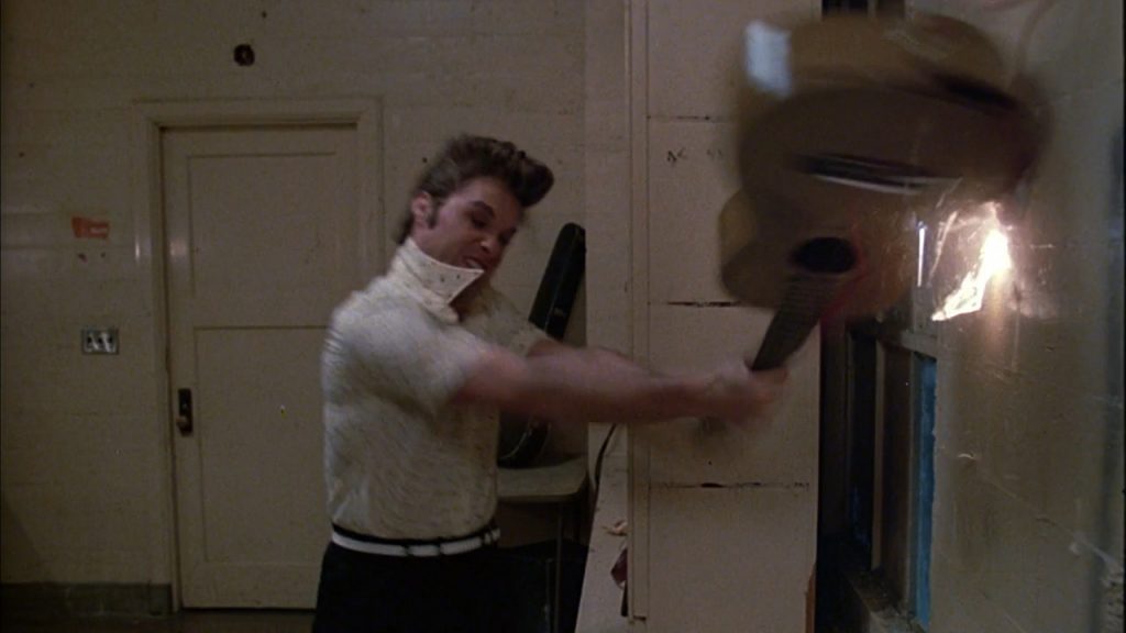 Kurt Russell trashing the guitar