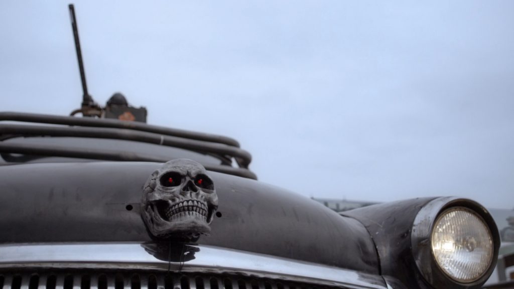 The skull on the hood of the GAZ-21 in the movie Death Race: Beyond Anarchy, Volgzilla