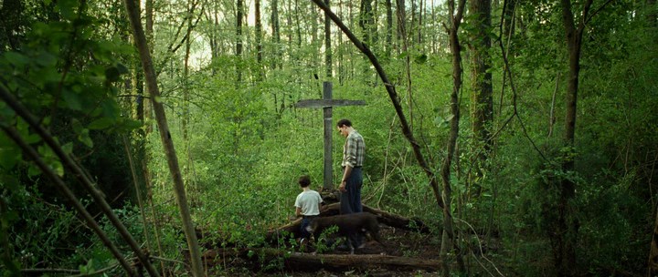 The Devil Is Always The Devil All the Time, a frame from the movie, a cross