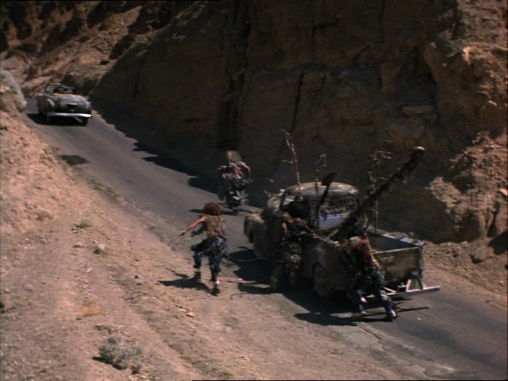 The chase, a shot from the movie Six-String Samurai