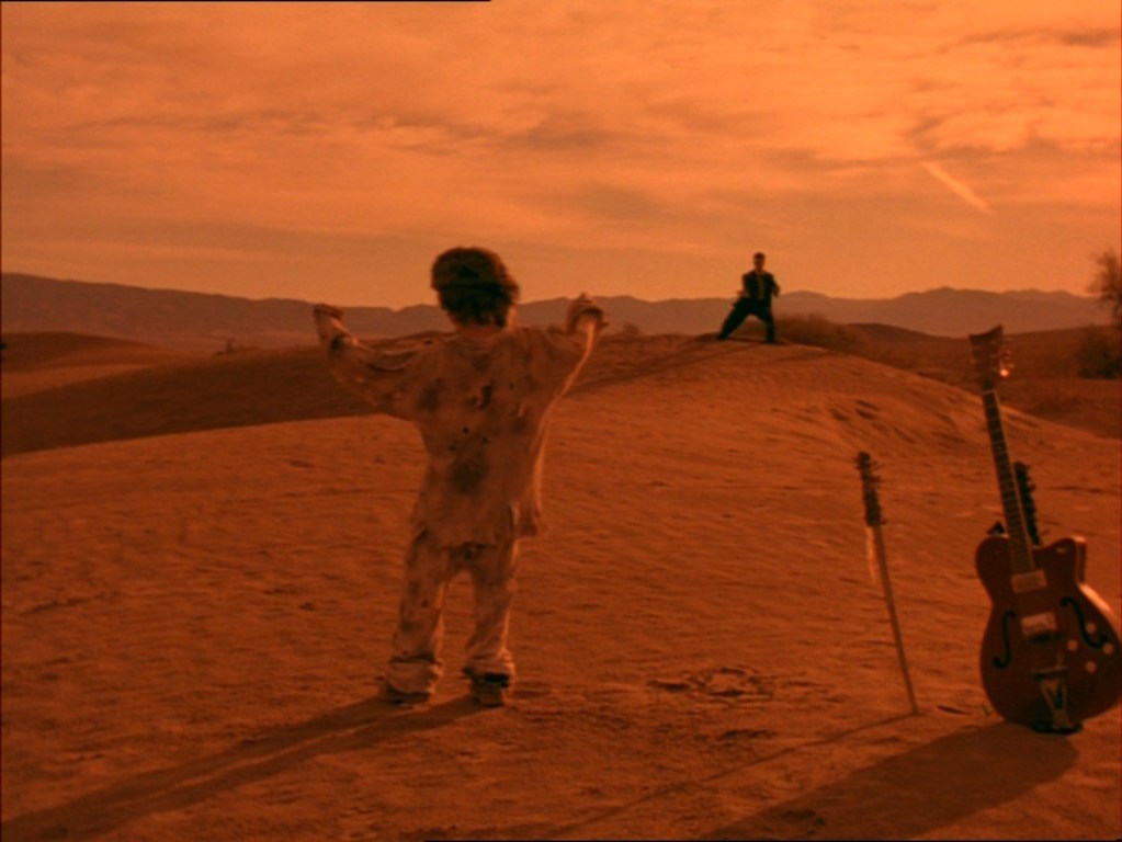 Six-stringed samurai, sunset in the desert