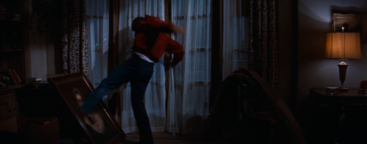Jim Stark (James Dean) breaks the portrait of his grandmother