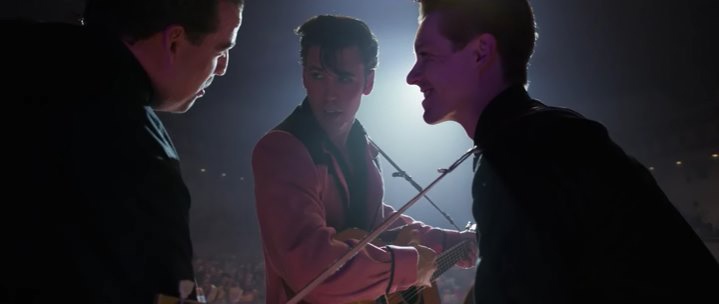 Bill Black, Elvis Presley, Scotty Moore on stage, a shot from the movie Elvis