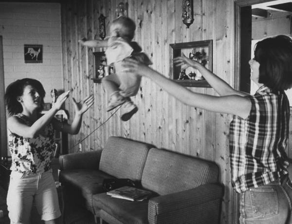 Sharon Breeze and Debbie Ellson play with Debbie's son