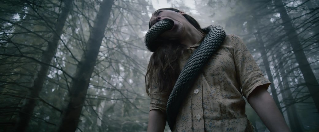 a shot from the movie Hellboy The Curse of the Hunchback 2024, snake in the mouth