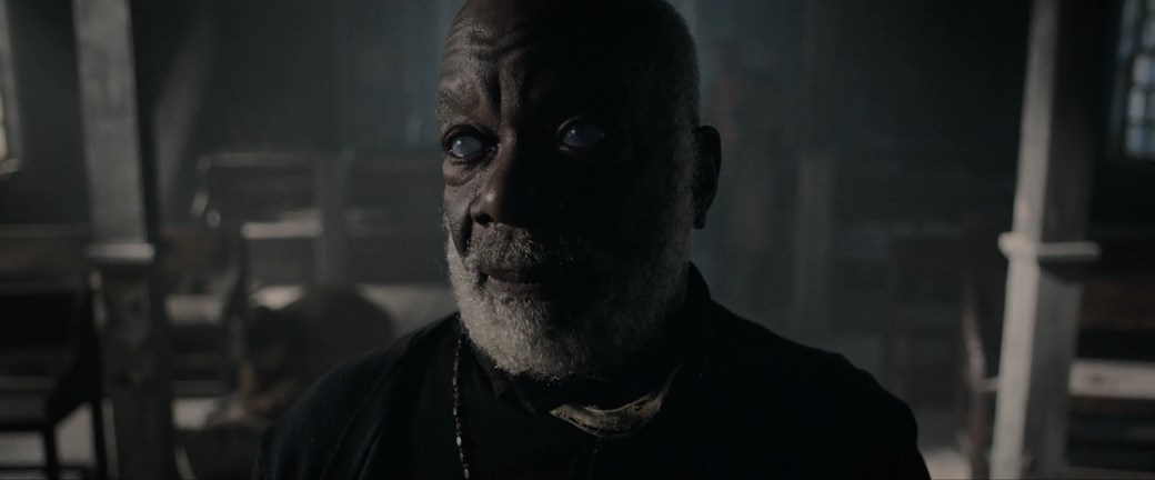the priest from the movie Hellboy The Hunchback's Curse 2024
