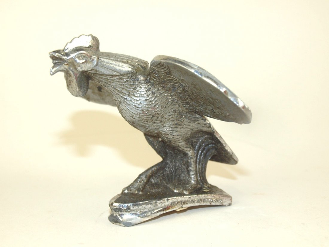A Rooster figurine on the hood of a hot rod Singer Bantam