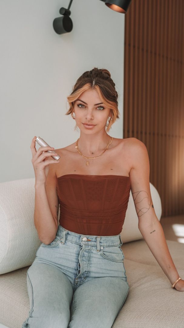girl Jessica Martin in a brown top and light blue jeans