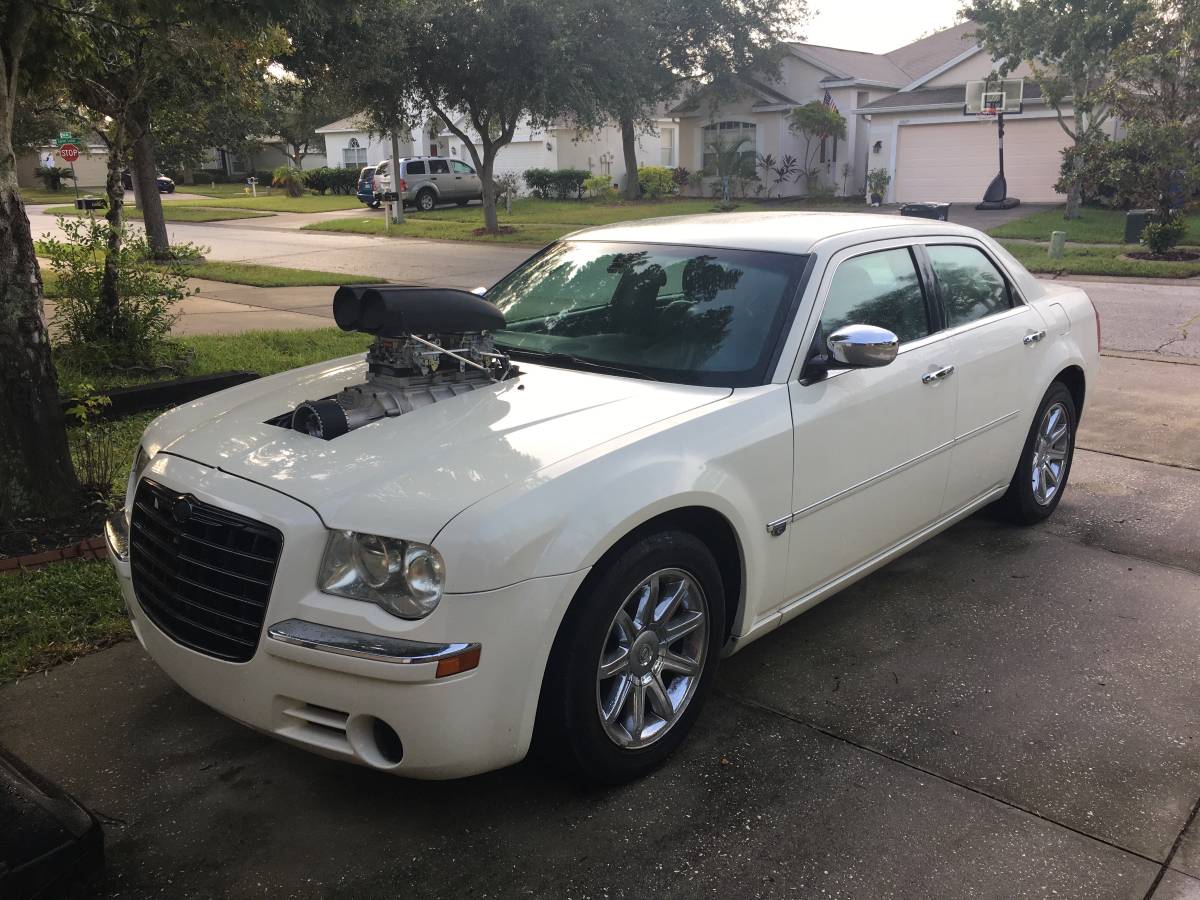 White Chrysler 300C with classic supercharging, photo 1.
