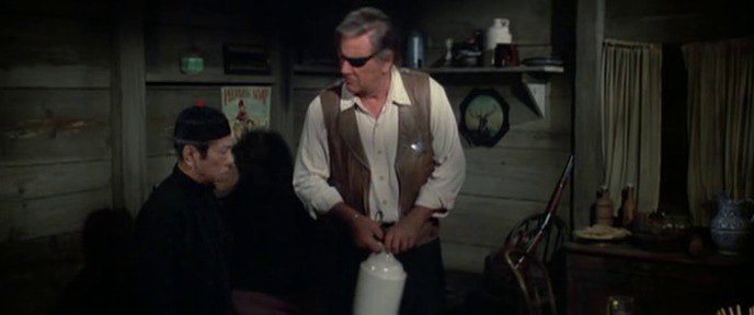 Rooster Cogburn (John Wayne) and his Chinese friend, played by Strother Martin