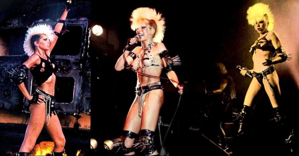 Wendy O. Williams on stage half naked with mohawk