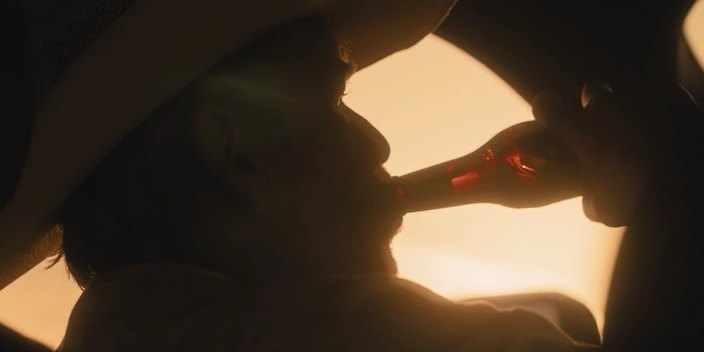 stuck to a bottle, a shot from the TV series Landman 2024
