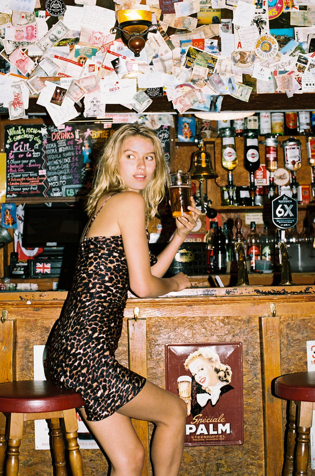 German model Lea Dina Mohr, photo in a bar in a leopard dress