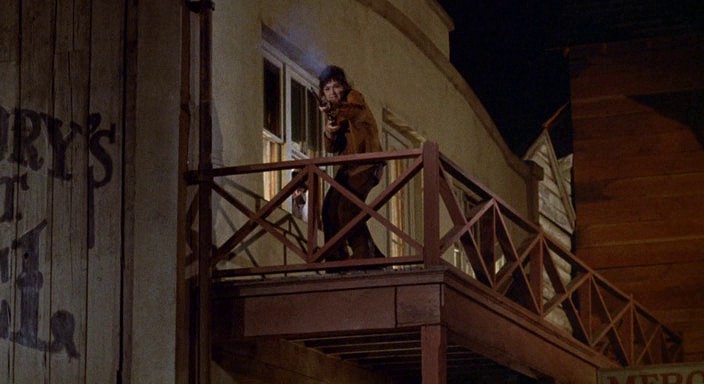 Pat tries to shoot Latigo, whom she mistook for the Trickster Morgan, Support YourLocal Gunfighter (1971)
