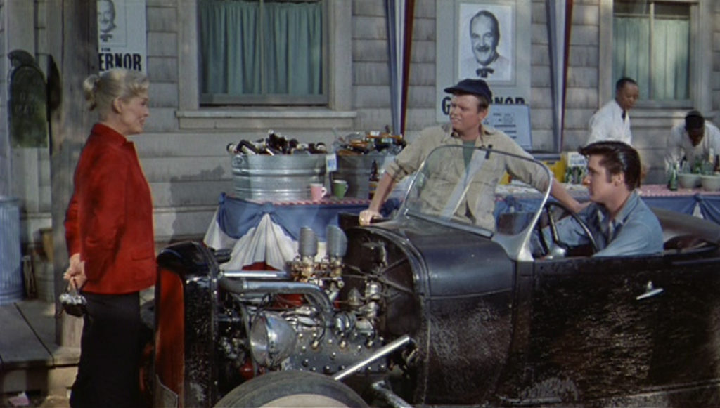 Elvis driving a hot rod in the movie Loving You 1957, a still from the movie
