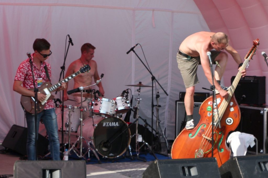 Lucky 12 band, open-air concert, topless drummer and double bass player, Yekaterinburg