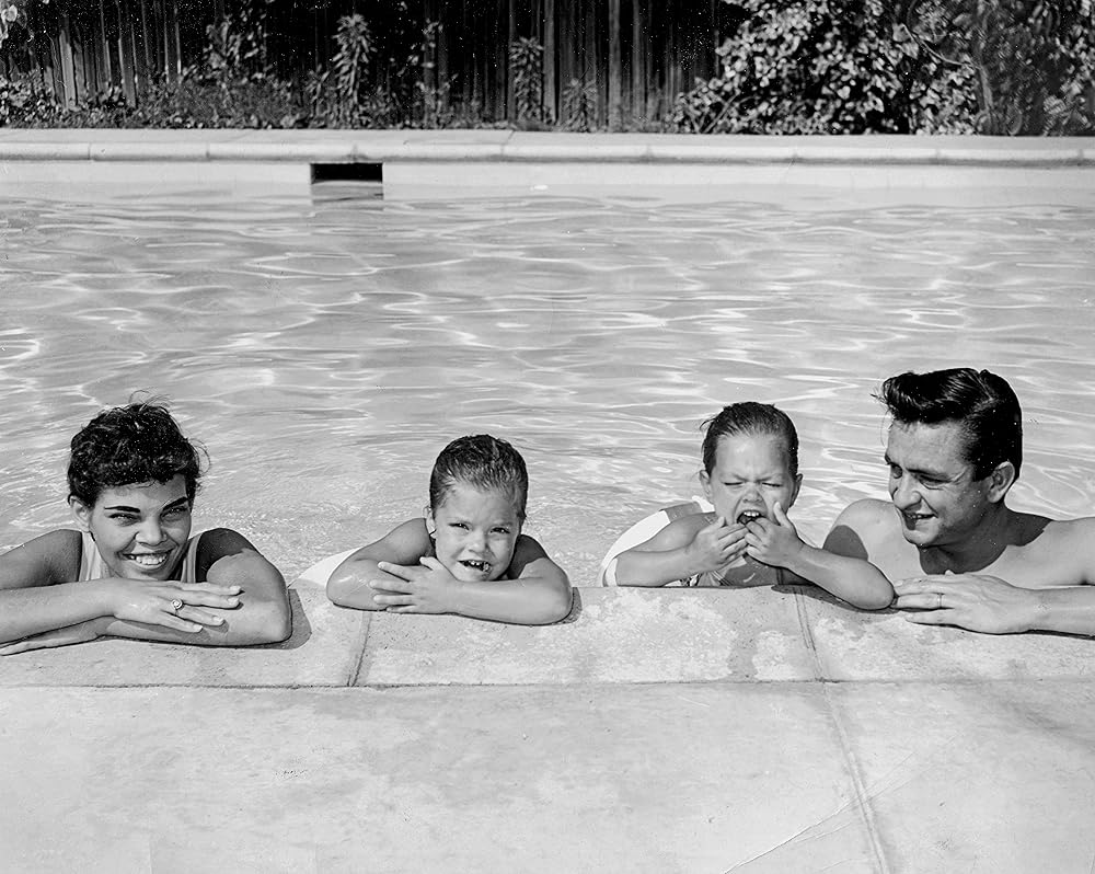 Vivian Cash, Rosanna and Katie, Johnny Cash in the pool at home in California, early 1960s