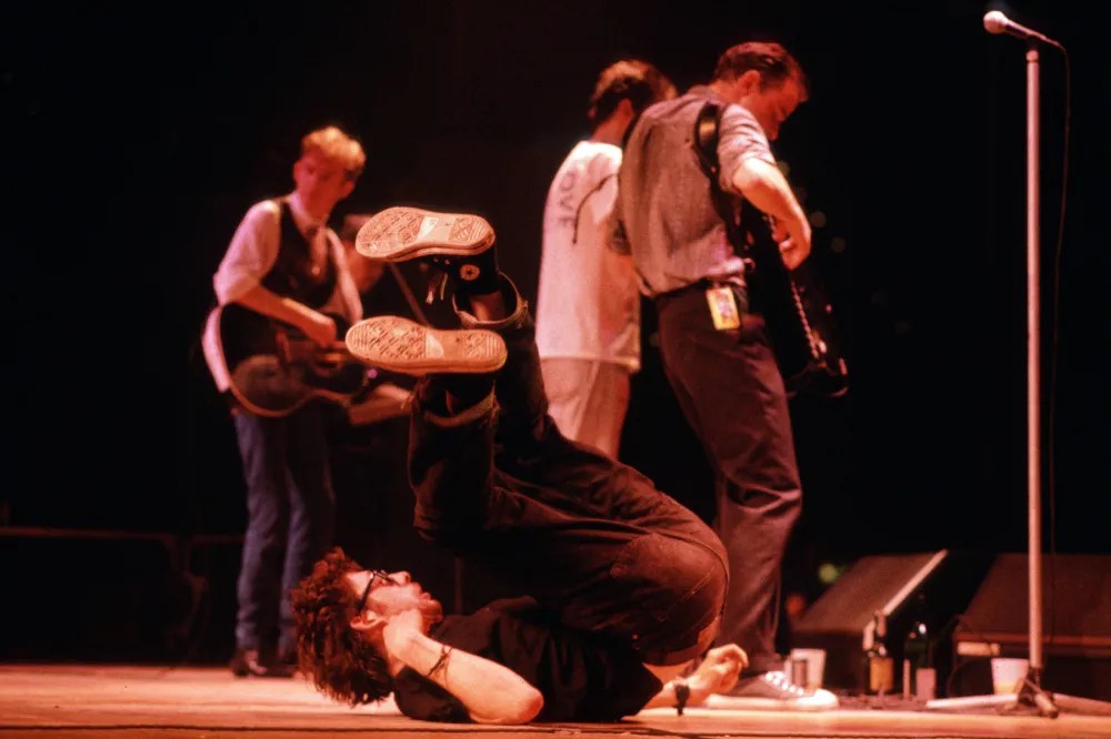 Shane MacGowan rides around the stage