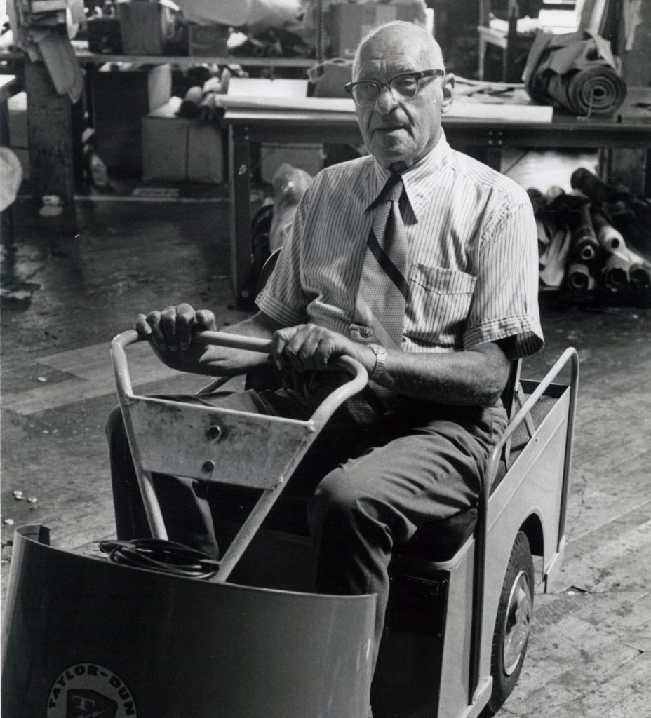 Irving Schott on a golf cart