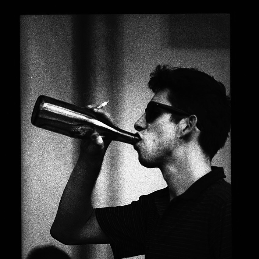 Shane MacGowan with a bottle, 80s
