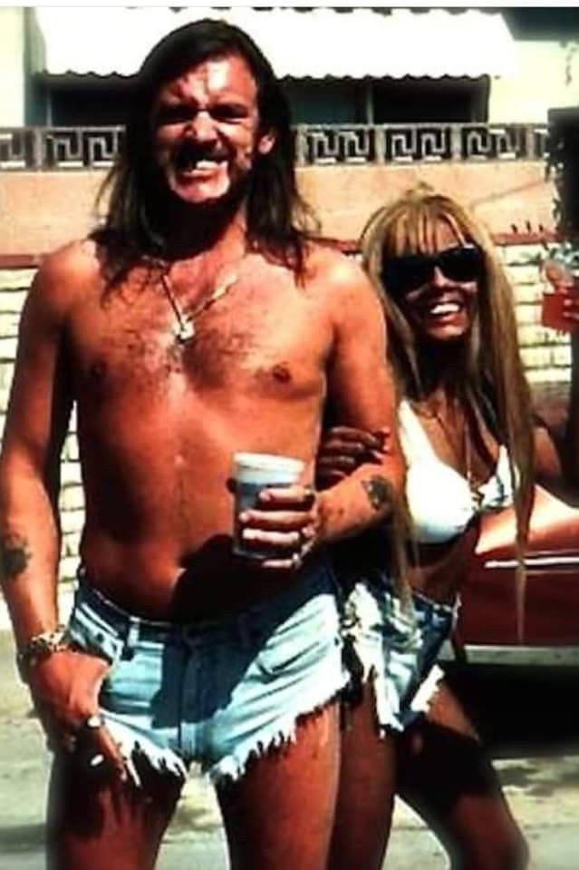 Half-naked Lemmy Kilmister and a tanned girl