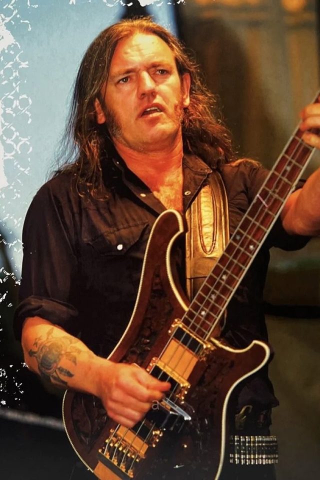 Lemmy on stage with bass rickenbacker