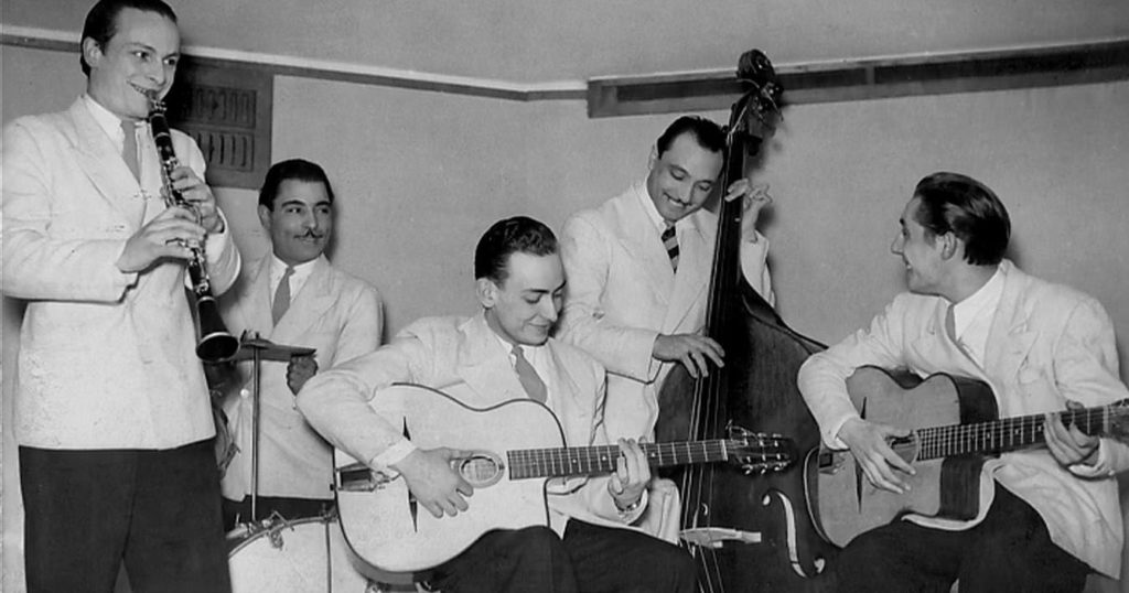Hubert Rostain plays Django's guitar, and Django Reinhardt plays the double bass.