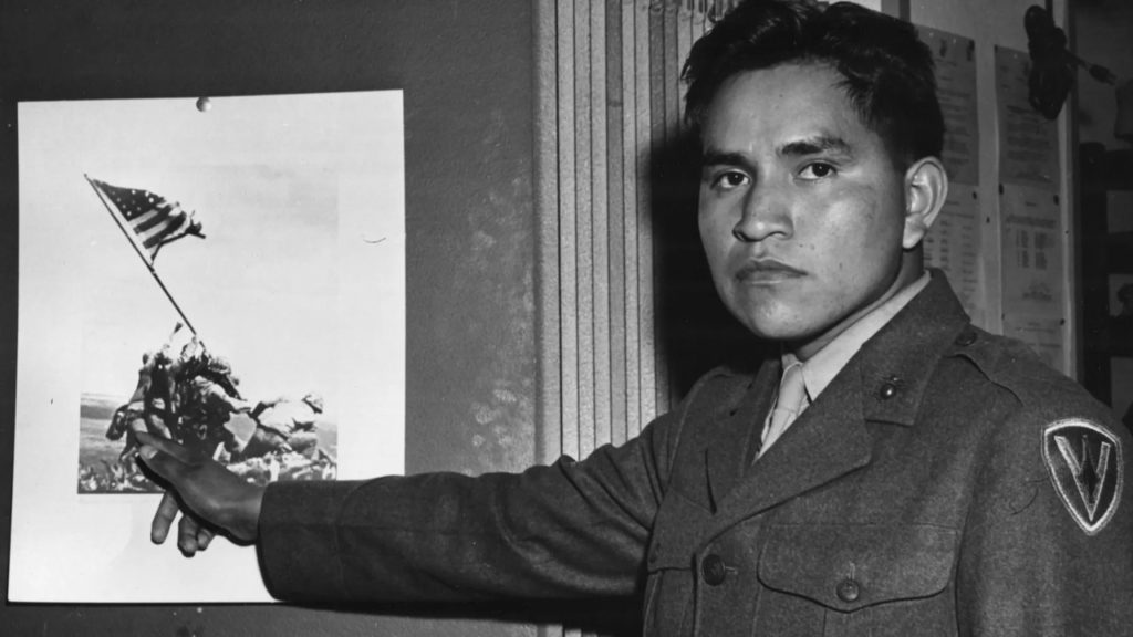 Ira Hayes, a native American Pima, shows himself in the same picture from Iwo Jima