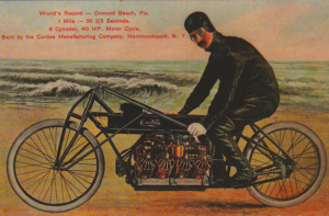 A flashed souvenir card, a tambnail for an article about a Curtiss V-8 motorcycle.