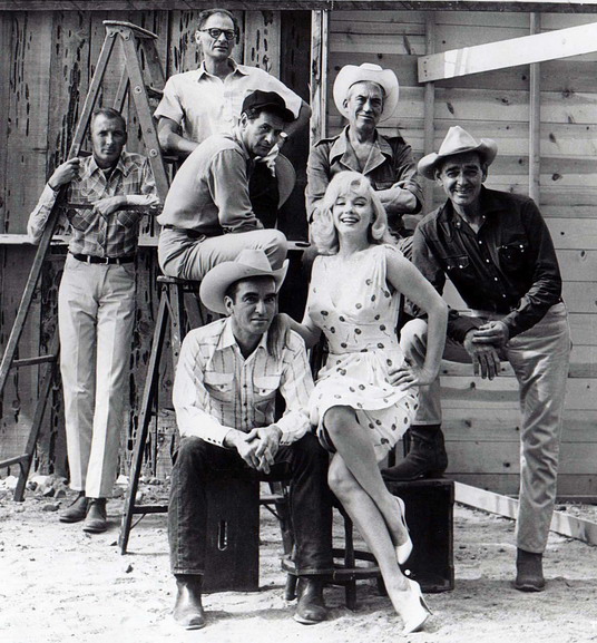 The Misfits 1961: film crew and main cast. Frank E. Taylor (producer), Arthur Miller (screenwriter), Eli Wallach, John Huston (director), Clark Gable, Montgomery Clift, Marilyn Monroe