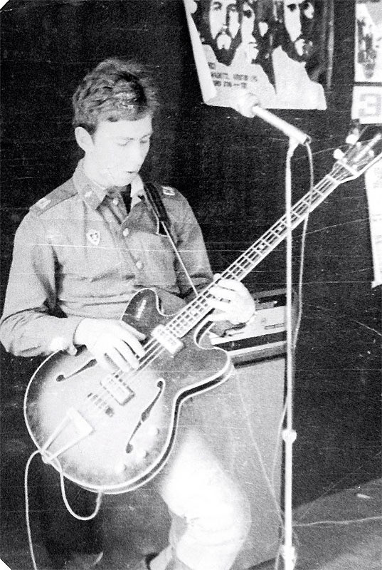 Valery Syutkin plays the bass guitar in the army.
