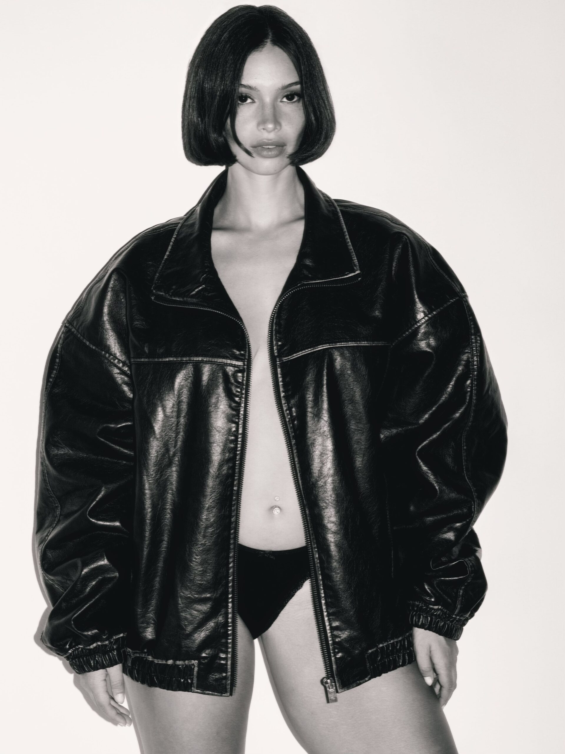 Naila van Kommer, black and white photo in a topless leather jacket